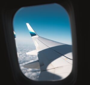 View of plane wing from airplane window